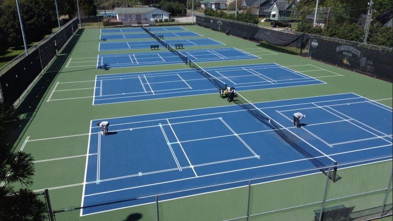 Tennis courts with drawn-on pickleball lines!