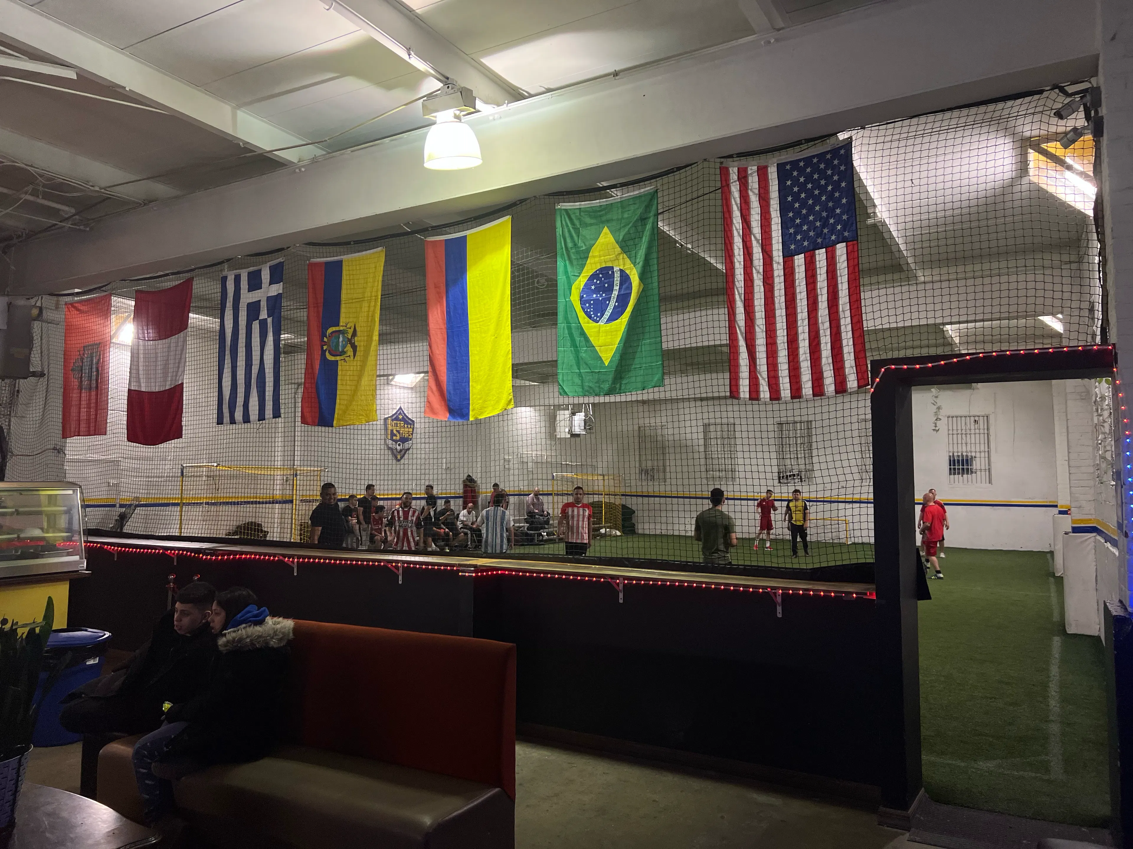 An indoor soccer field with a viewing room right next to the pitch!